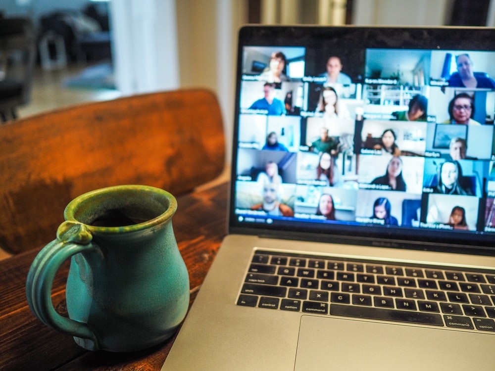 Laptop with image of virtual training or conference