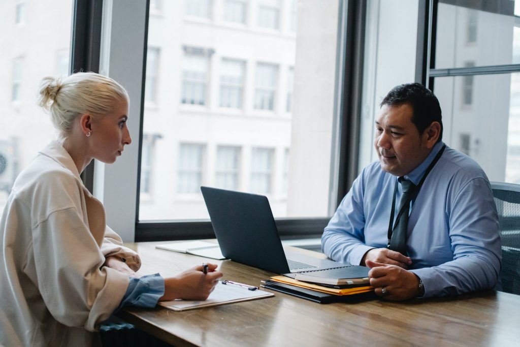 Two people involved in project meeting.