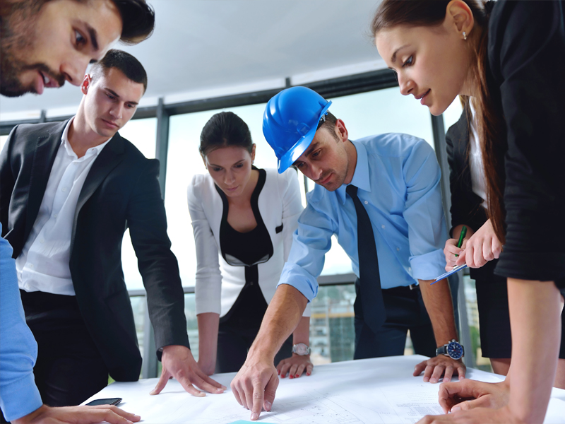 Multiple people working collaboratively on a project.