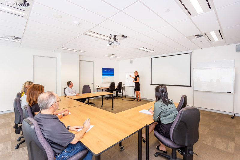 ATI-Mirage team members in a large ATI-Mirage conference room.