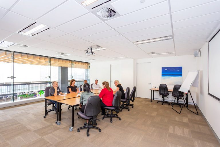 ATI-Mirage team members in a large ATI-Mirage conference room.